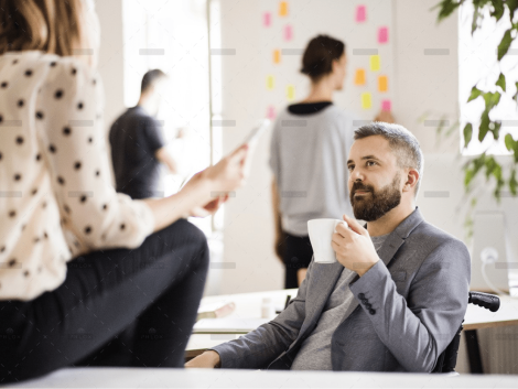 demo-attachment-2832-business-people-with-wheelchair-in-the-office-P9M4RX3